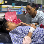Mother reunited with 8-year-old who climbed trees to survive Nepal&hellip;