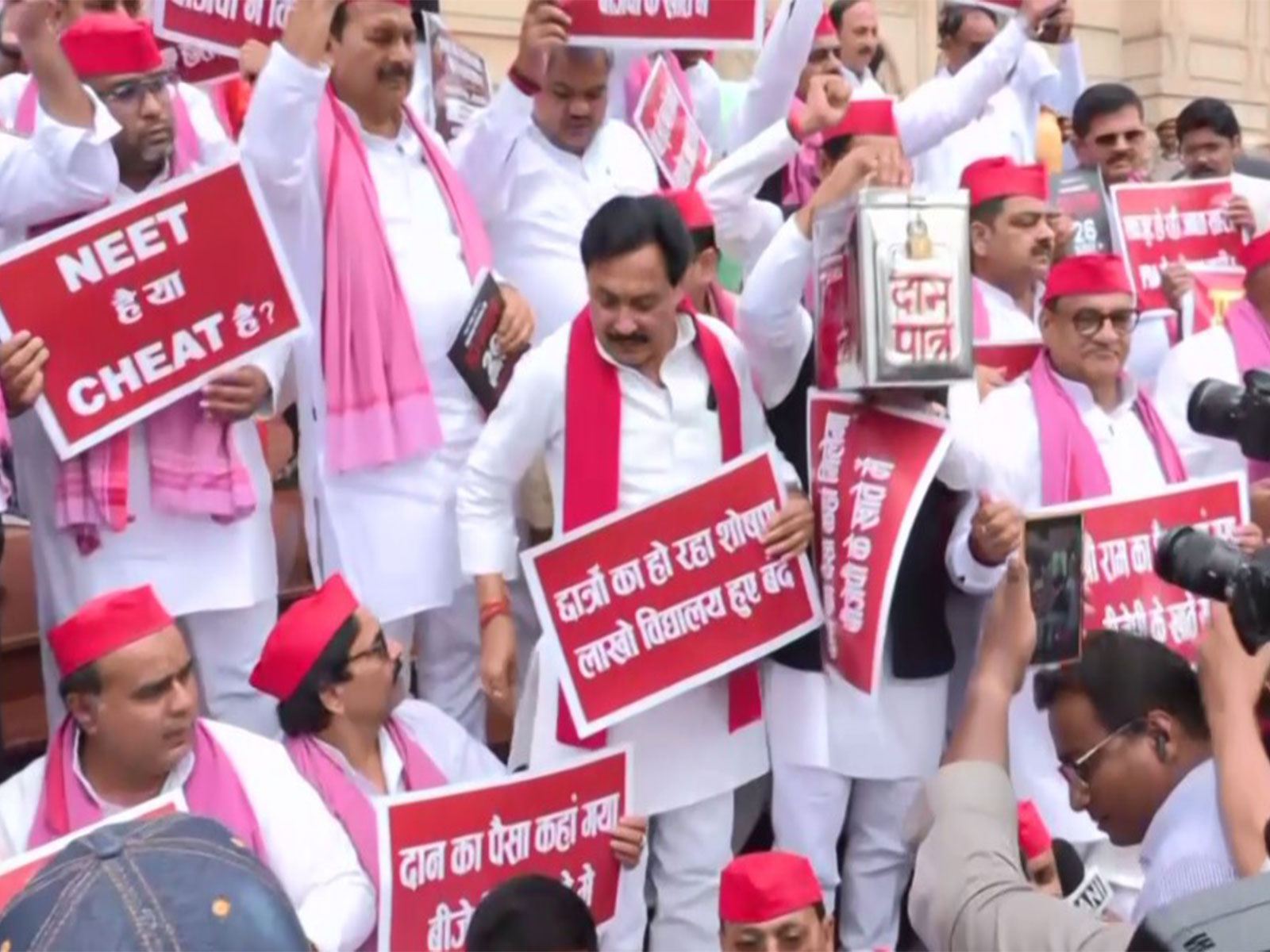 Samajwadi Party MLAs protest outside UP assembly (Photo/ANI) Samajwadi Party MLAs protest outside UP assembly (Photo/ANI)