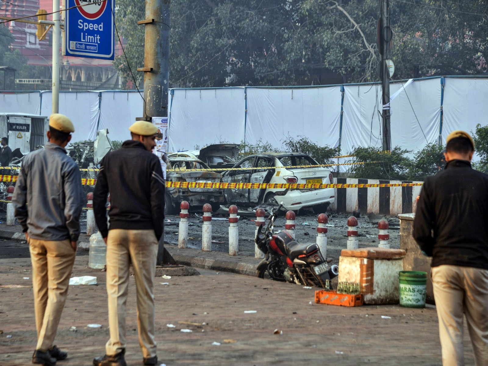 Police personnel stand at the site of the blast in a Hyundai i20 car near Gate no 1 of the Red Fort Metro station (File Photo/ANI)