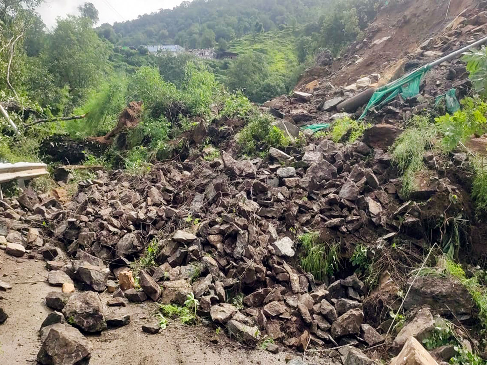 Road blocked due to debris on the Yamunotri National Highway following continuous rockfall in Uttarkashi district (PhotoANI)