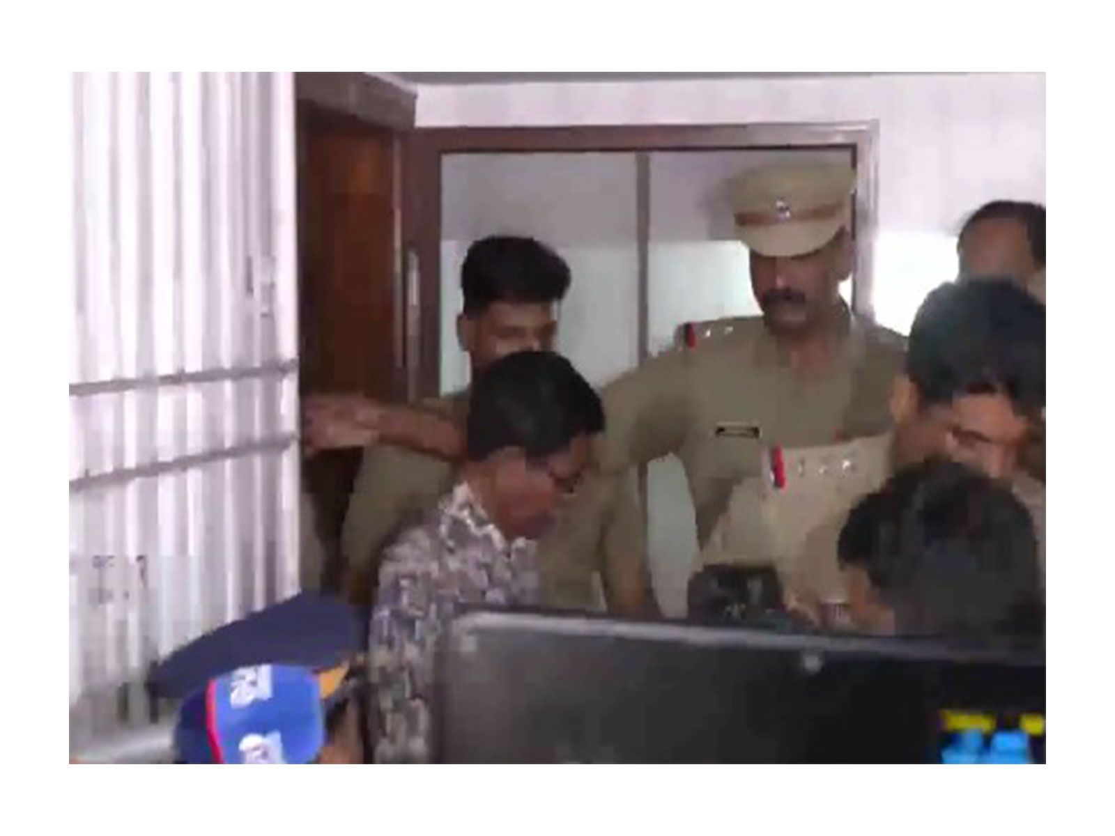 TG Mohandas being taken into custody (Photo/ANI) TG Mohandas being taken into custody (Photo/ANI)