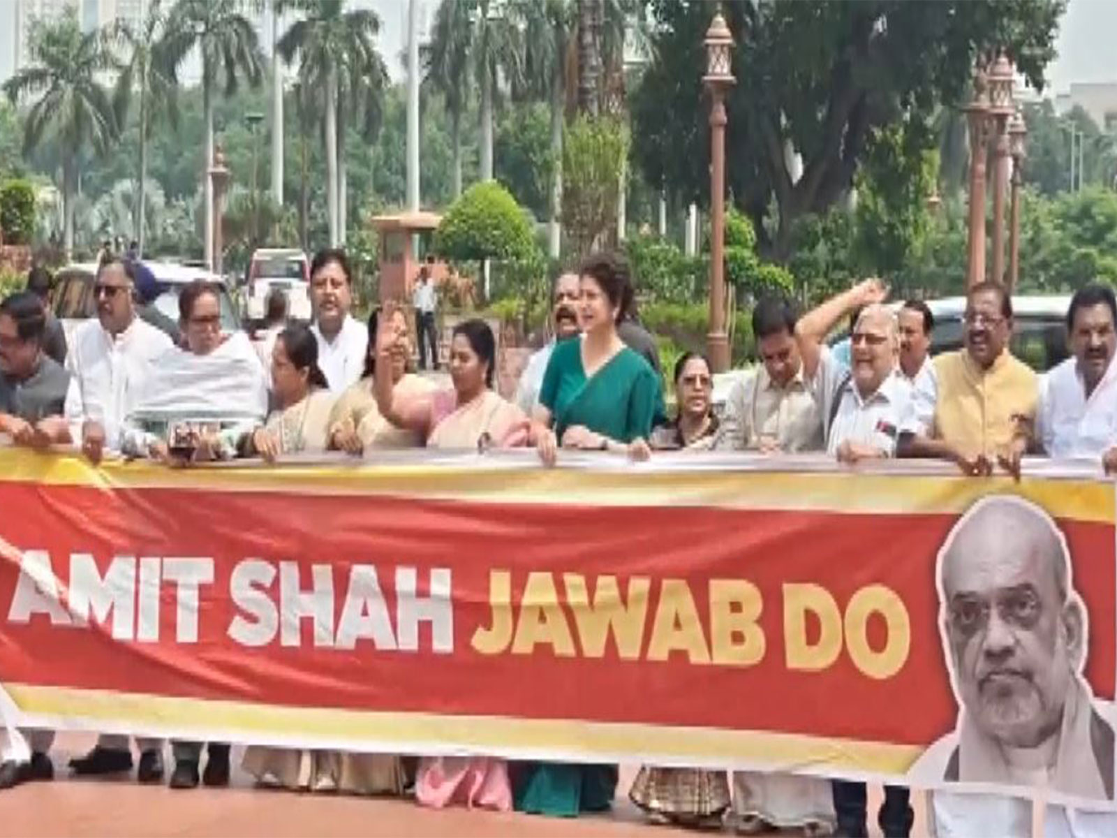 Opposition MPs protest in Parliament (Photo/ANI) Opposition MPs protest in Parliament (Photo/ANI)