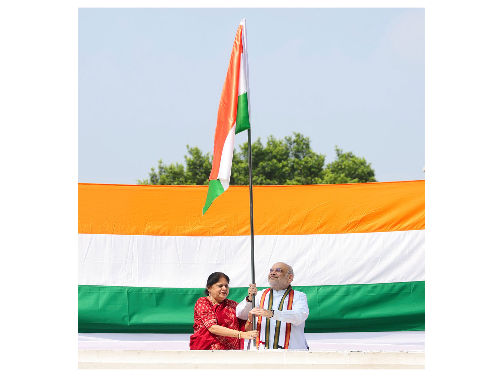 Union Minister Amit Shah hoists Tiranga flag at his residence (Photo/X/@AmitShah) Union Minister Amit Shah hoists Tiranga flag at his residence (Photo/X/@AmitShah)