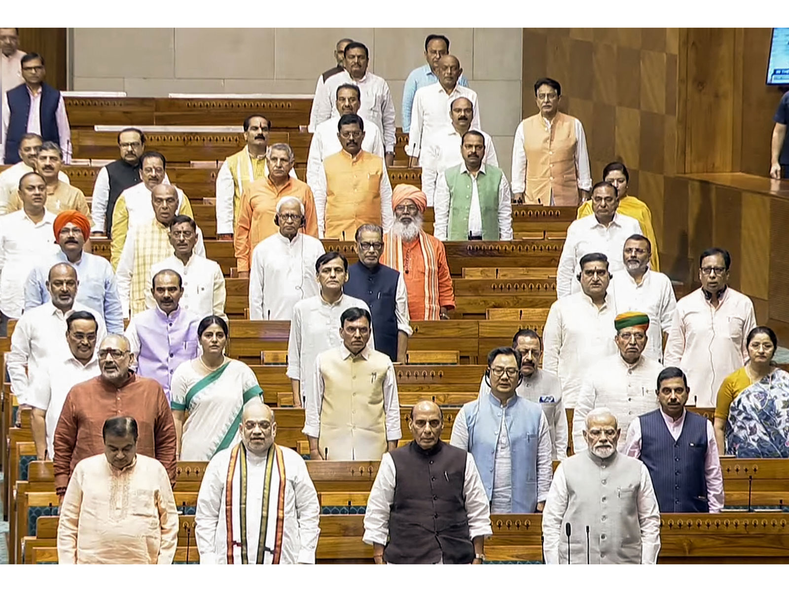 Prime Minister Narendra Modi stands for 'Vande Mataram' in Lok Sabha during the Monsoon Session in New Delhi on Thursday. Union Ministers Amit Shah, Rajnath Singh and others are also present (Photo: Sansad TV) Prime Minister Narendra Modi stands for 'Vande Mataram' in Lok Sabha during the Monsoon Session in New Delhi on Thursday. Union Ministers Amit Shah, Rajnath Singh and others are also present (Photo: Sansad TV)