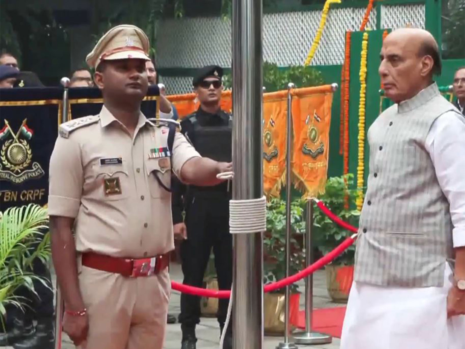Defence Minister Rajnath Singh hoists tricolour at residence on 80th Independence Day (Photo/ANI)