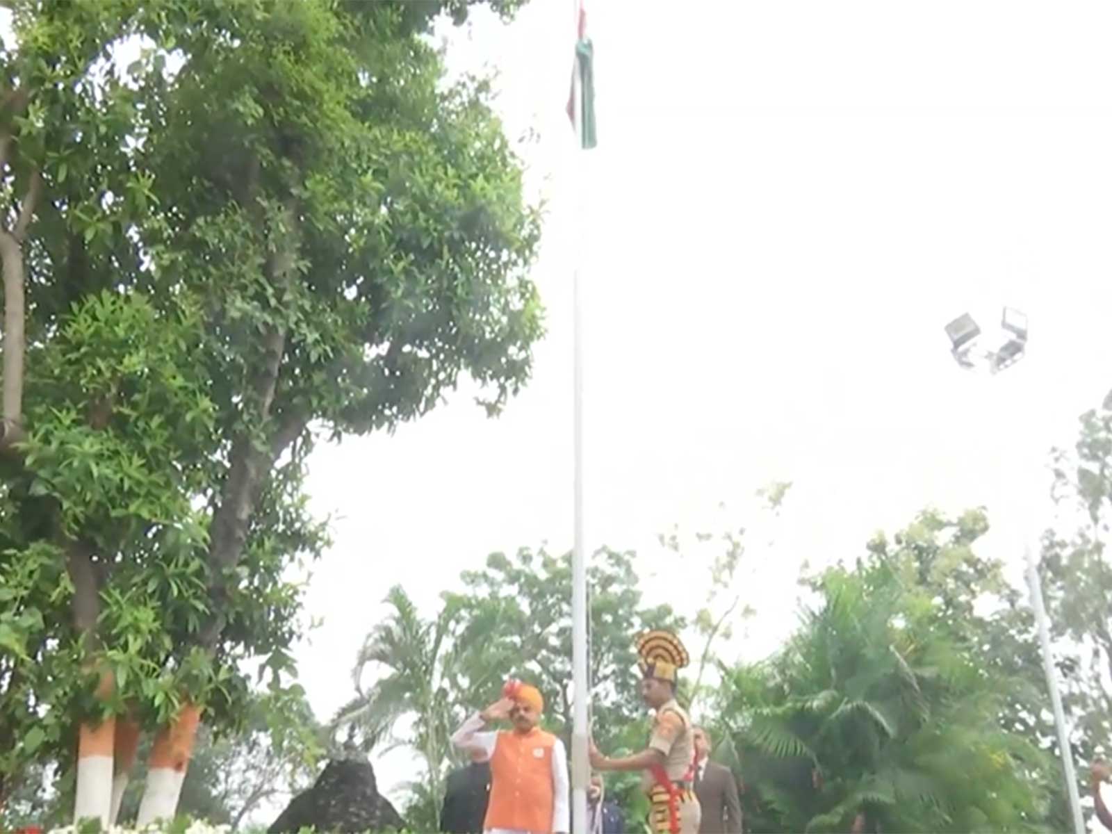 MP CM Mohan Yadav hoists Tricolour at official residence in Bhopal (Photo/ANI)