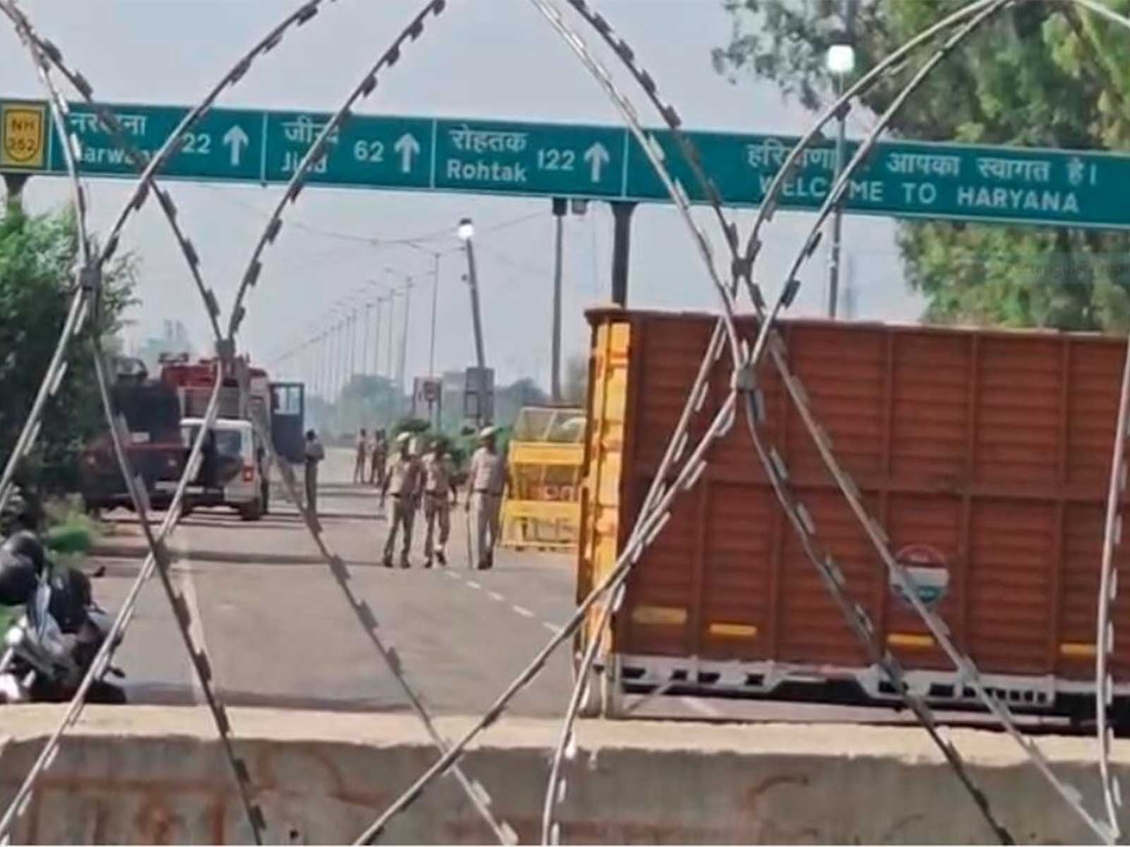 Haryana Police blocks the road leading towards Delhi at the Khanauri border (Photo/ANI) Haryana Police blocks the road leading towards Delhi at the Khanauri border (Photo/ANI)