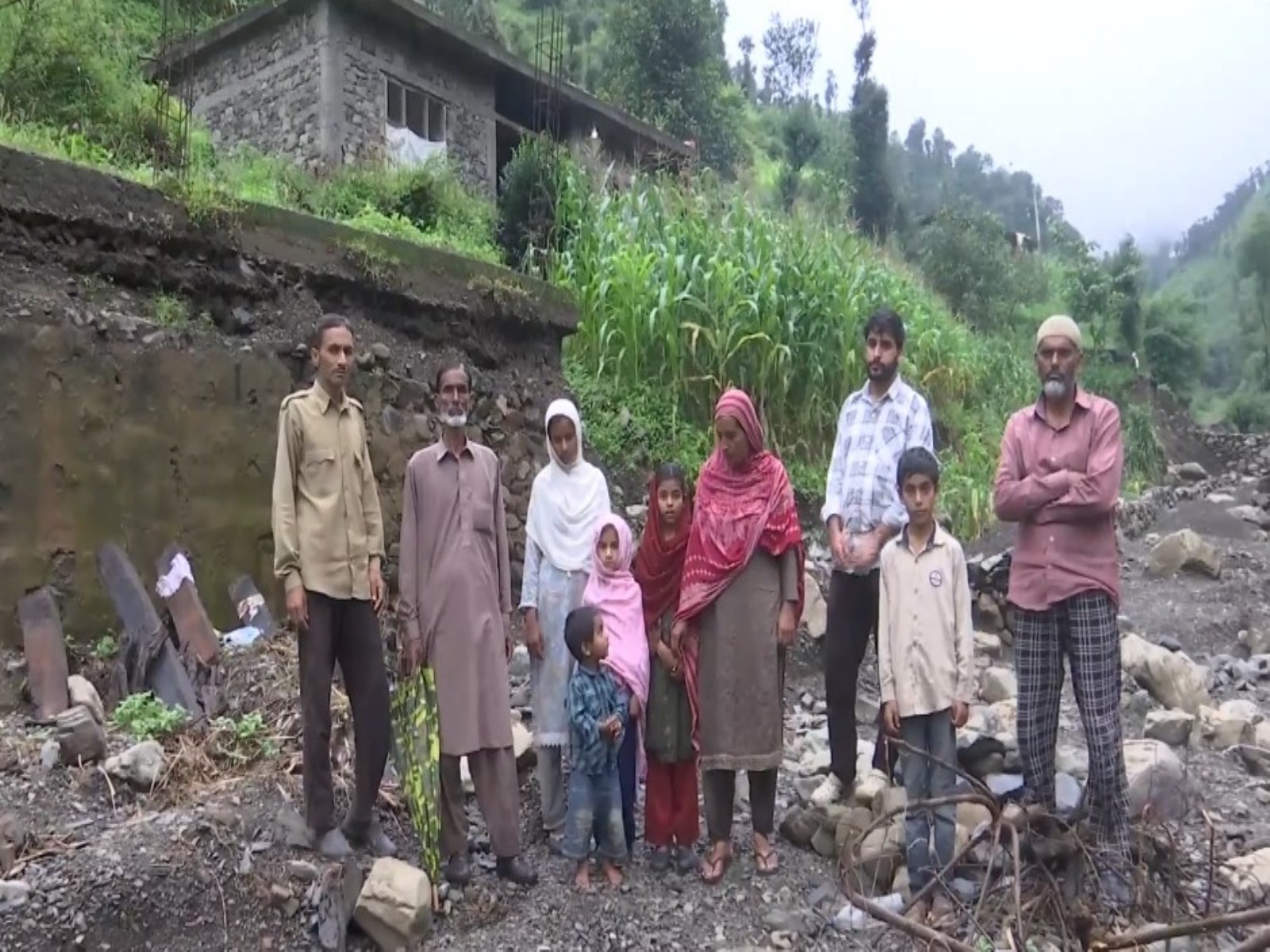 A family, whose house got washed away in the flash flood (Photo: ANI) A family, whose house got washed away in the flash flood (Photo: ANI)