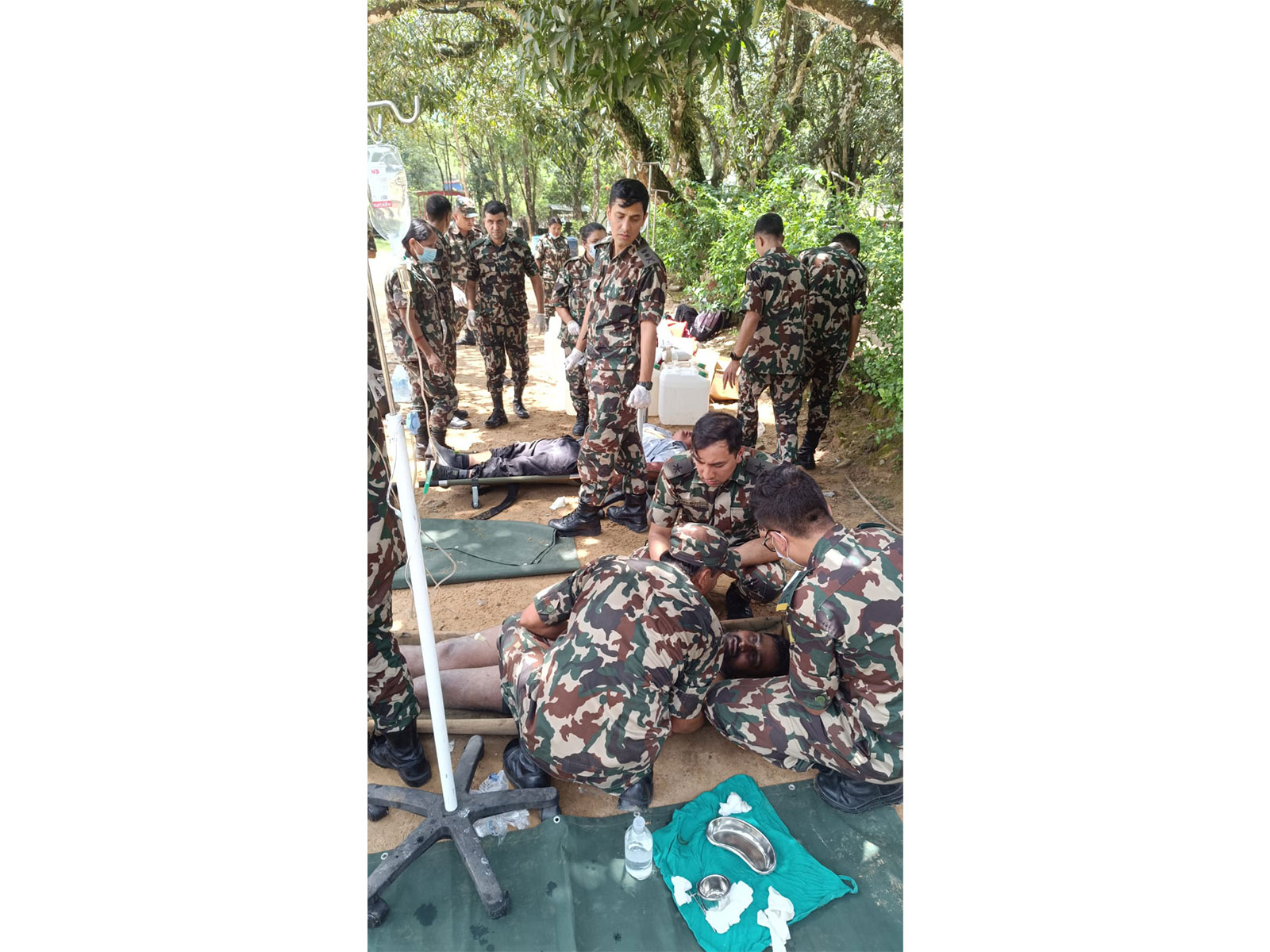 Nepali security personnel and medical staff provide emergency treatment and first aid to injured individuals following a sudden flood caused by an outburst in the Bhotekoshi River in the Rasuwa District. (Image Source: Nepal PMO) Nepali security personnel and medical staff provide emergency treatment and first aid to injured individuals following a sudden flood caused by an outburst in the Bhotekoshi River in the Rasuwa District. (Image Source: Nepal PMO)