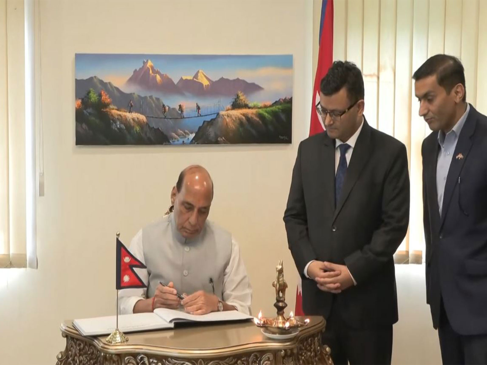 Defence Minister Rajnath Singh signs condolence book at Nepal Embassy over Nepal floods (Photo/ANI) Defence Minister Rajnath Singh signs condolence book at Nepal Embassy over Nepal floods (Photo/ANI)