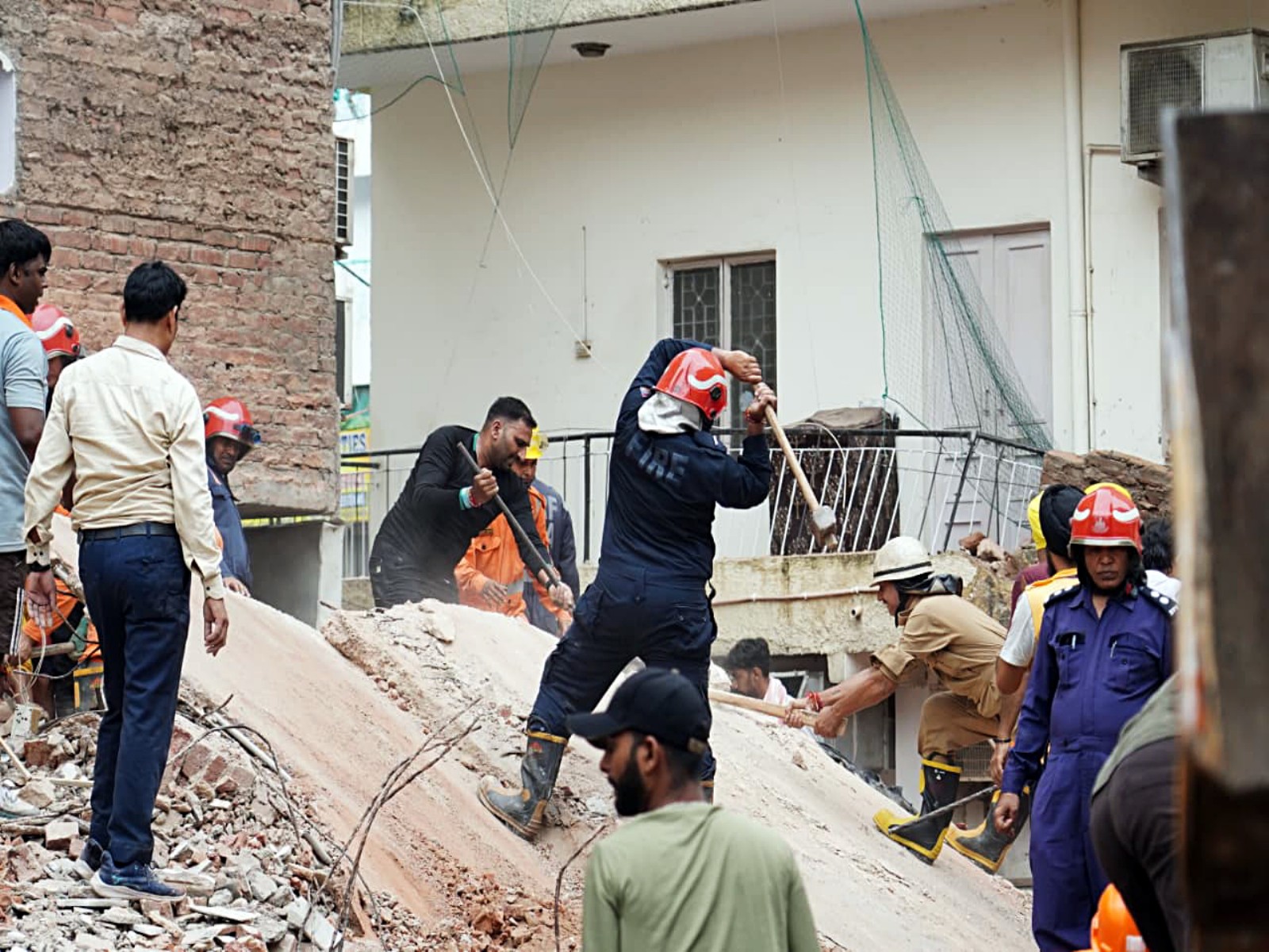 Rescue operations underway at the site of a building collapse at Satya Niketan (Photo/ANI) Rescue operations underway at the site of a building collapse at Satya Niketan (Photo/ANI)