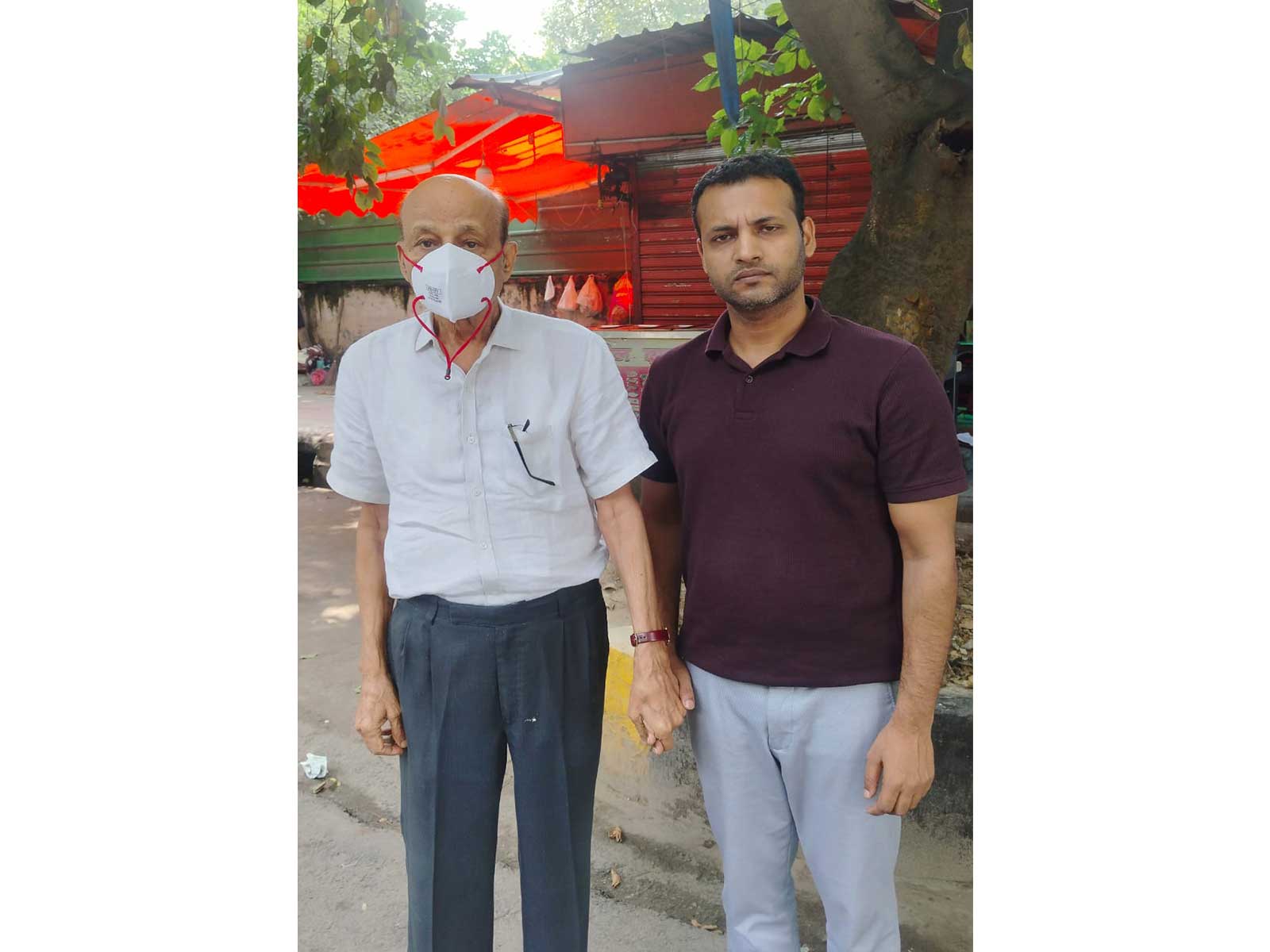 Hariram, the owner of the building that collapsed in Satya Niketan with a Delhi Police official (Photo/ANI) Hariram, the owner of the building that collapsed in Satya Niketan with a Delhi Police official (Photo/ANI)