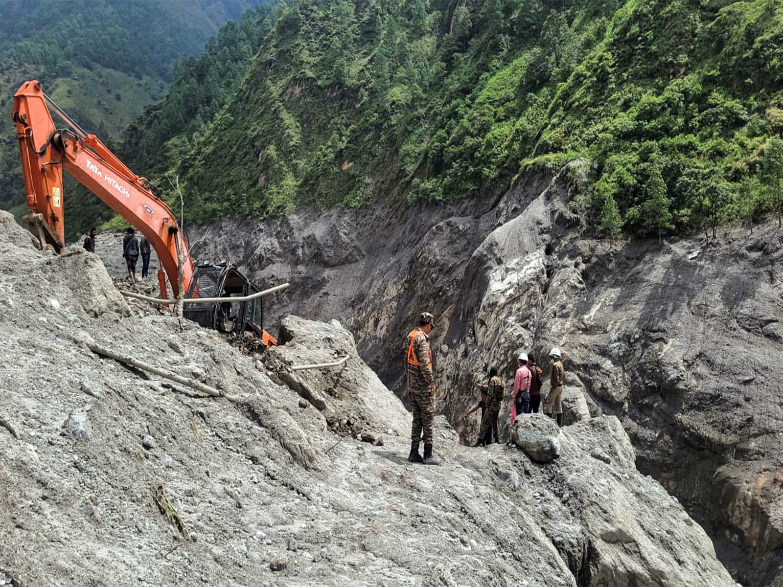 A joint team of India and Nepal works to construct the road towards the flood-hit hydropower tunnel as part of rescue operations, at Chilime in Rasuwa (Photo/ANI)