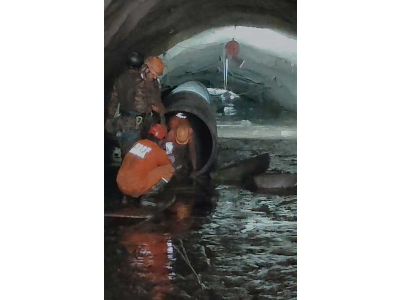 Rescue personnel engaged in dewatering and slush removal operations inside the tunnel located in flood-hit Nepal's Chilime area. (Photo/ANI)