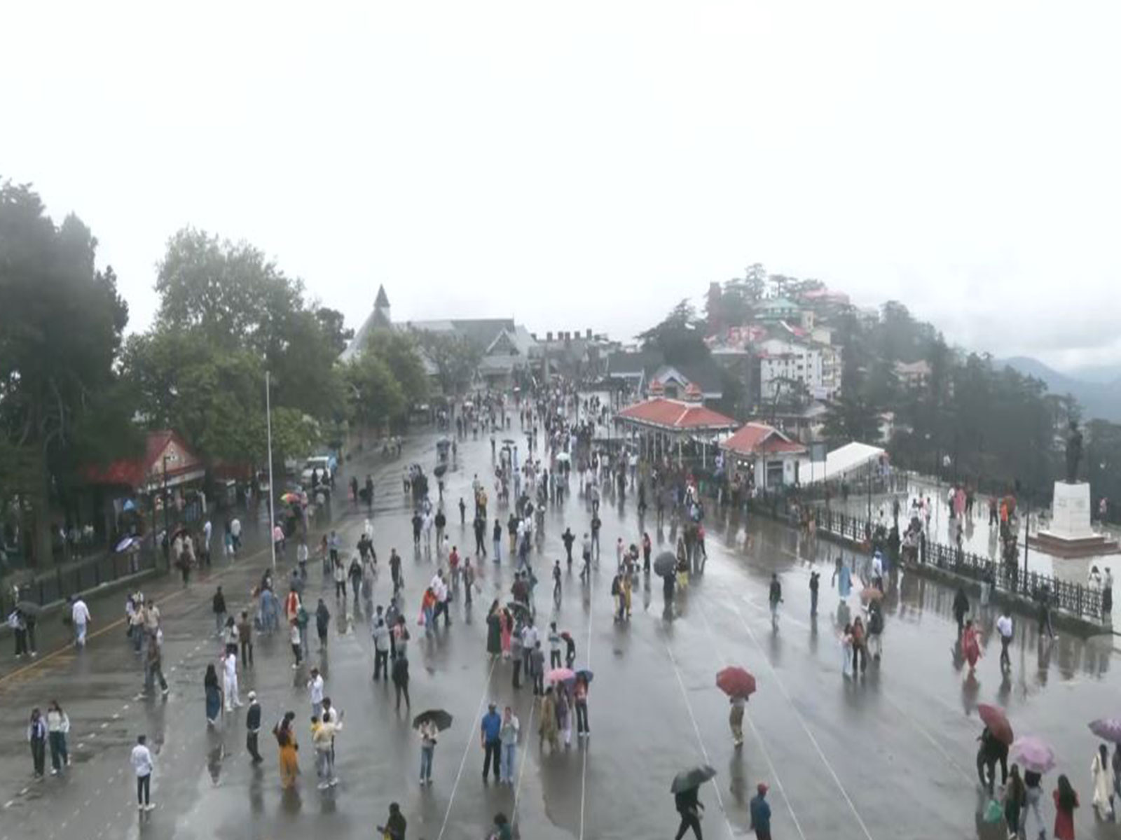 Tourists enjoy pleasant weather after rain in Shimla (Photo/ANI) Tourists enjoy pleasant weather after rain in Shimla (Photo/ANI)