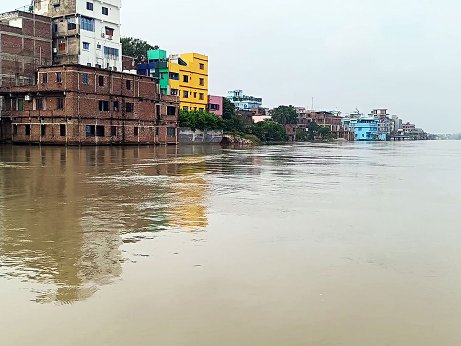 Residential and commercial buildings remain partially submerged as the swollen Ganga River continues to flow above the danger mark in Bhagalpur (Photo/ANI) Residential and commercial buildings remain partially submerged as the swollen Ganga River continues to flow above the danger mark in Bhagalpur (Photo/ANI)