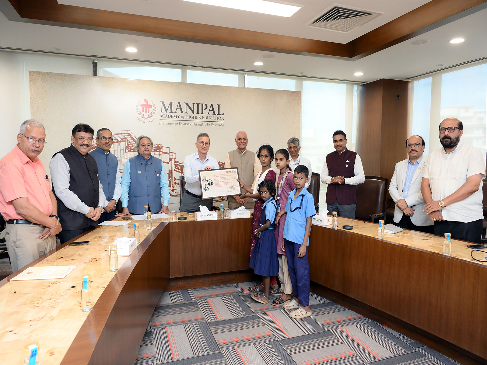 Dr Ranjan R. Pai, President, MAHE Trust, with the beneficiary family at the launch of the housing initiative for families of economically weaker students in Manipal Dr Ranjan R. Pai, President, MAHE Trust, with the beneficiary family at the launch of the housing initiative for families of economically weaker students in Manipal