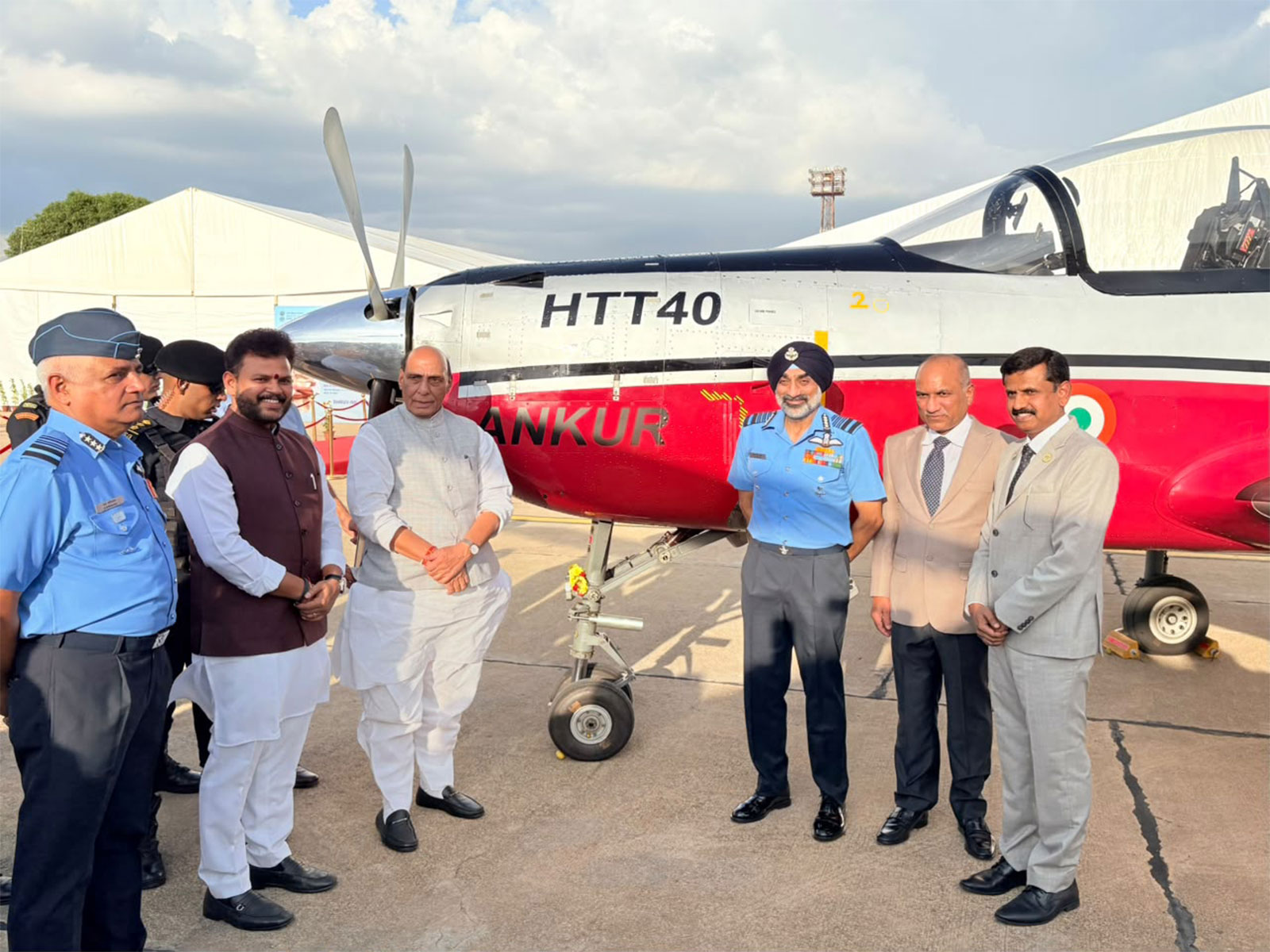 Defence Minister Rajnath Singh with Aviation Minister Ram Mohan Naidu and Navy officials (Photo/ANI)