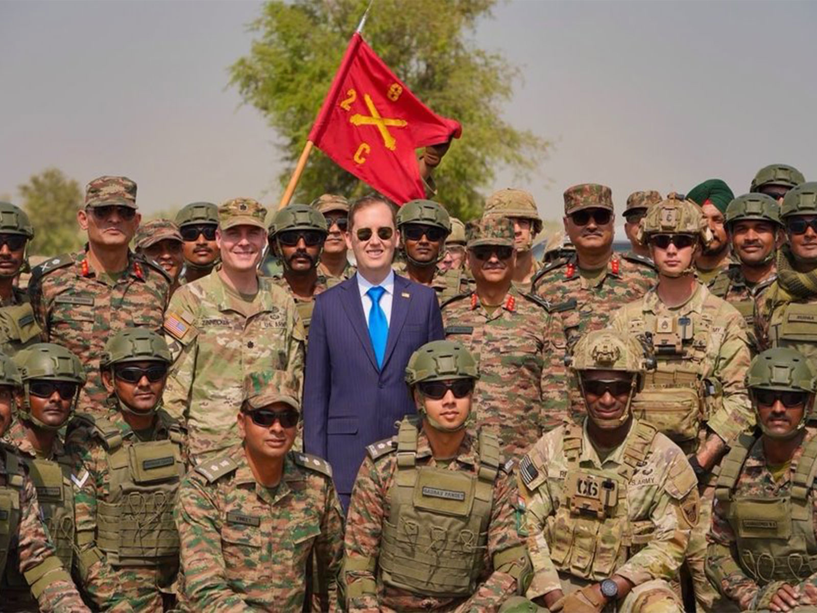 US Ambassador to India Sergio Gor poses with Indian Army and US Army personnel during his visit to the Mahajan Field Firing Range in Rajasthan for Exercise Yudh Abhyas 2026. (Photo: X/@USAmbIndia)