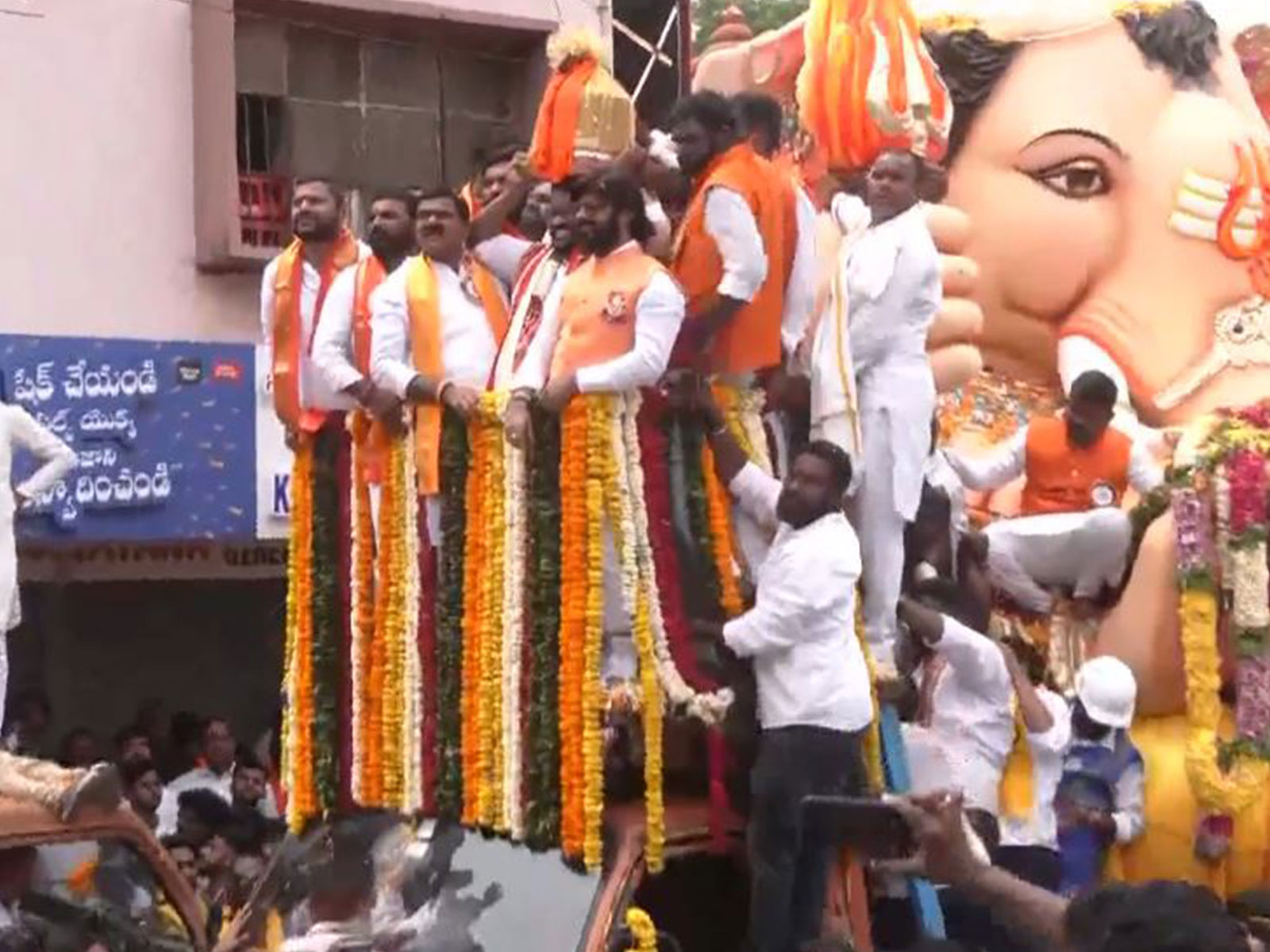 Devotees celebrating the winner of Balapur Ganesh Laddu auction (Photo/ANI) Devotees celebrating the winner of Balapur Ganesh Laddu auction (Photo/ANI)