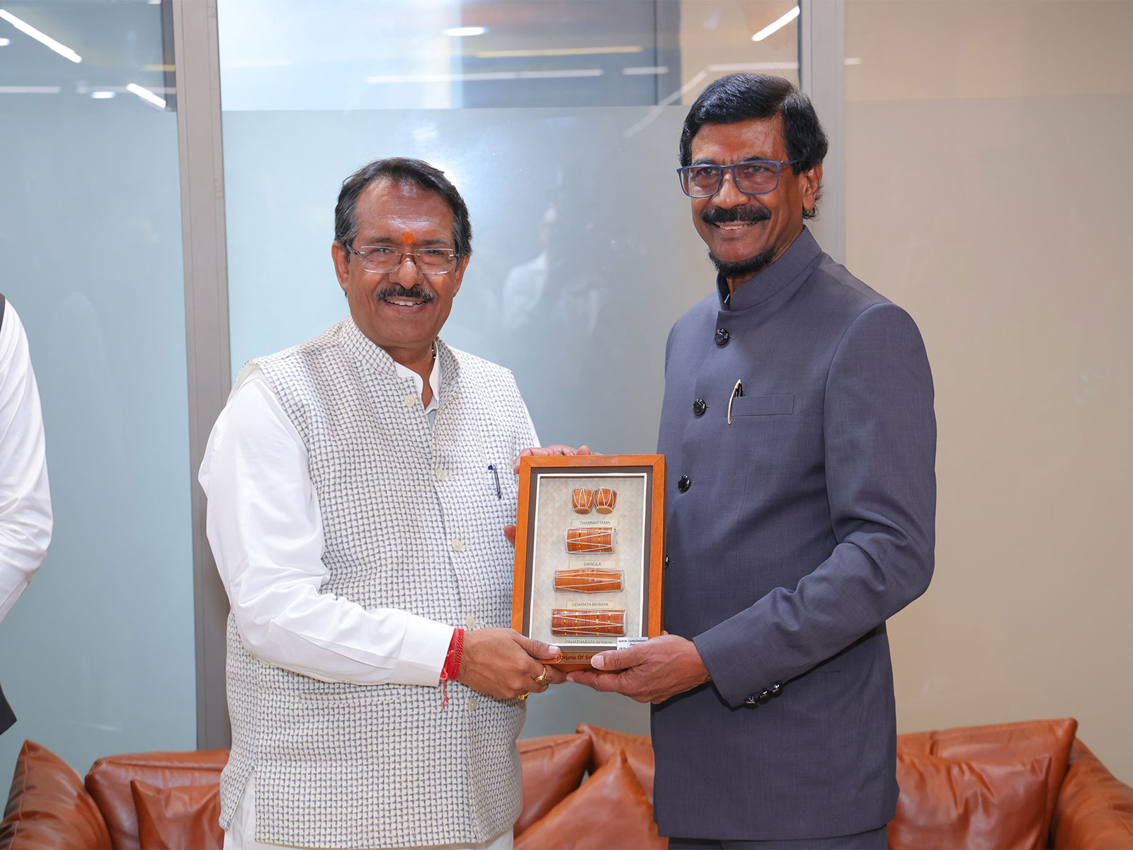 Sri Lankan ruling Janatha Vimukthi Peramuna (JVP) party General Secretary Tilvin Silva (On right) and  Delhi BJP President Harsh Malhotra (Photo/ANI) 