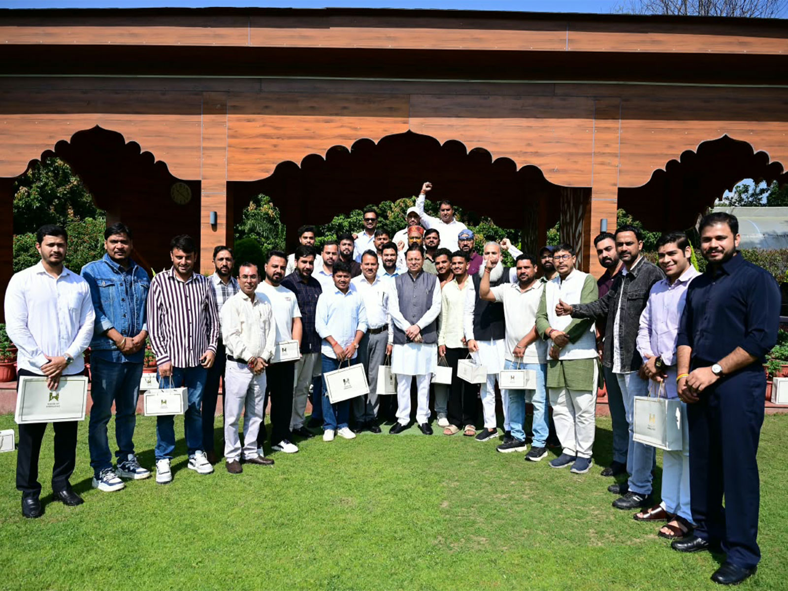 Uttarakhand Chief minsiter Pushkar Singh Dhami along with youths from Haryana (Photo/ANI)