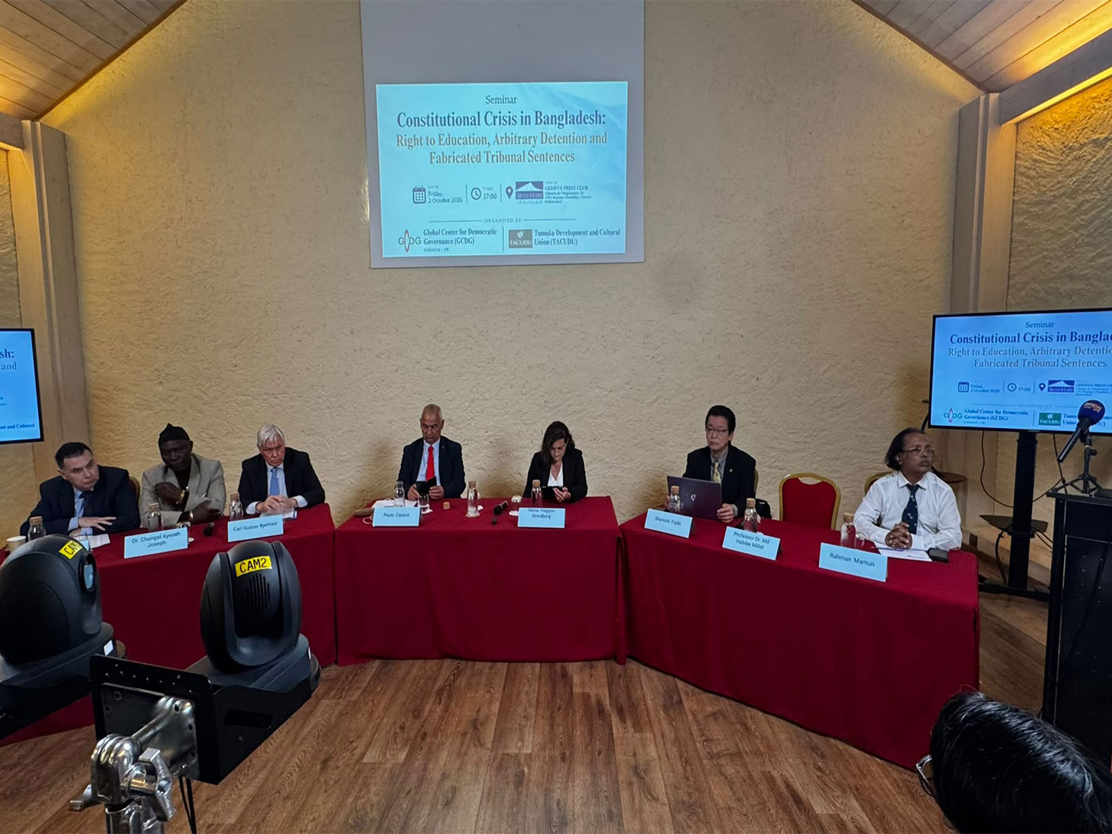 Speakers and panellists are seen addressing a seminar titled 