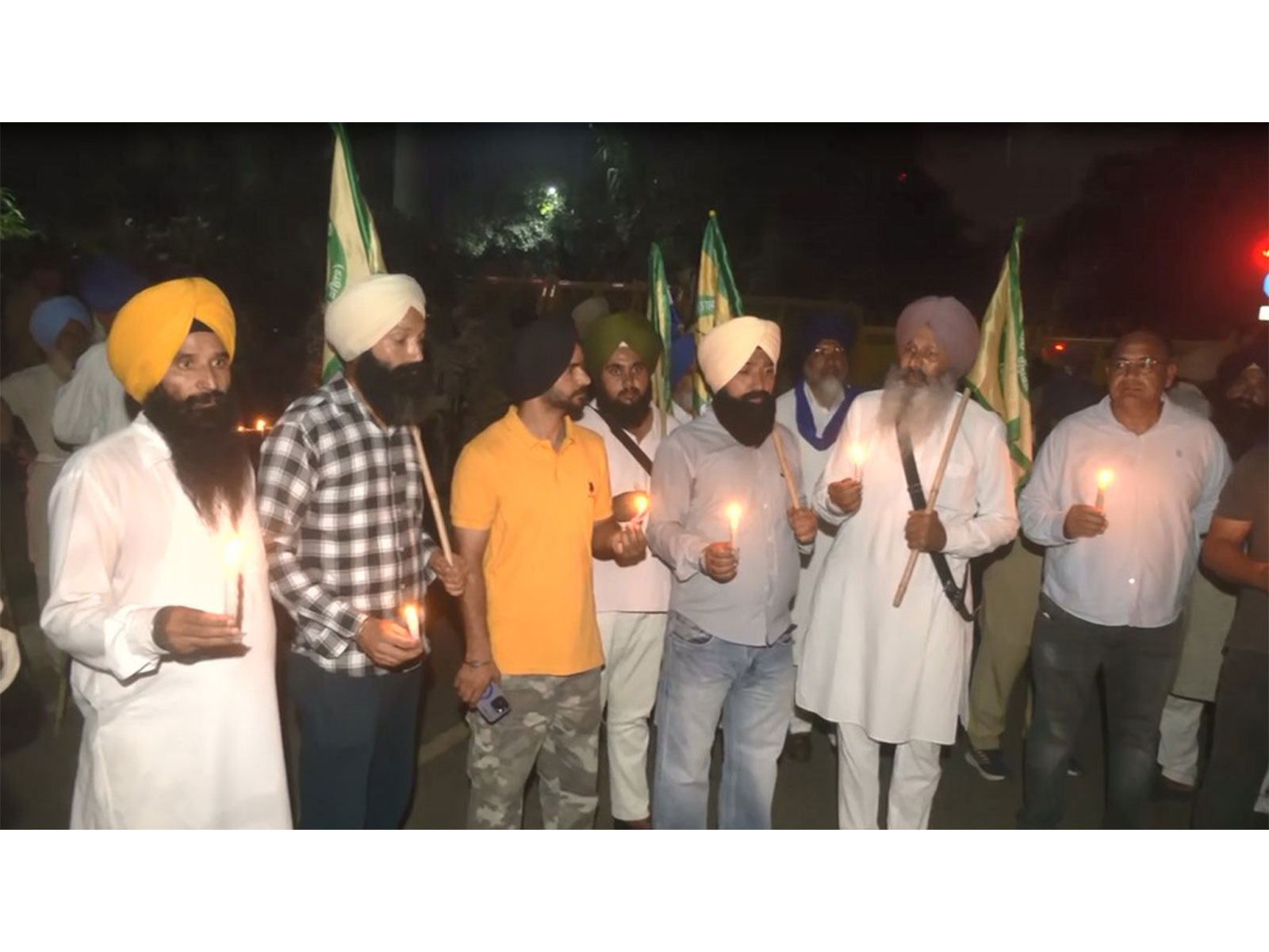 SKM, Kisan Mazdoor Morcha hold candle march to mark 2021 Lakhimpur Kheri incident anniversary (Photo/ANI) SKM, Kisan Mazdoor Morcha hold candle march to mark 2021 Lakhimpur Kheri incident anniversary (Photo/ANI)