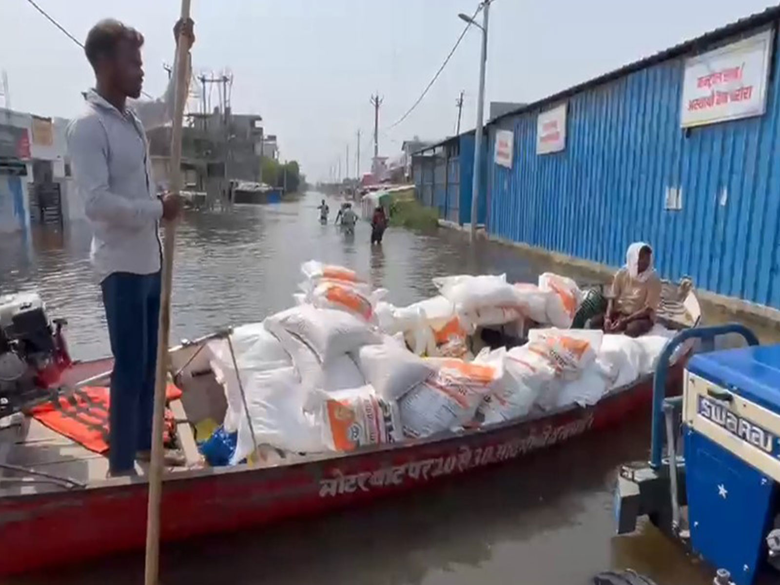 Boats are being used deliver relief supplies to affected families (Photo/ANI)