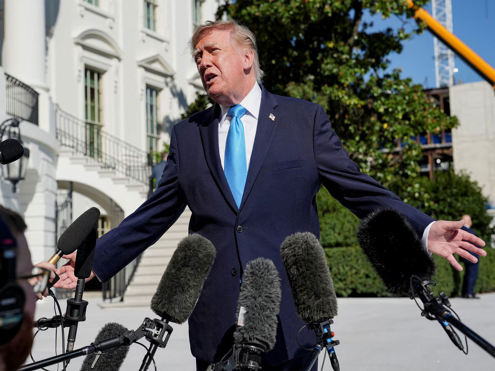 Trump warns Iran, open to direct talks