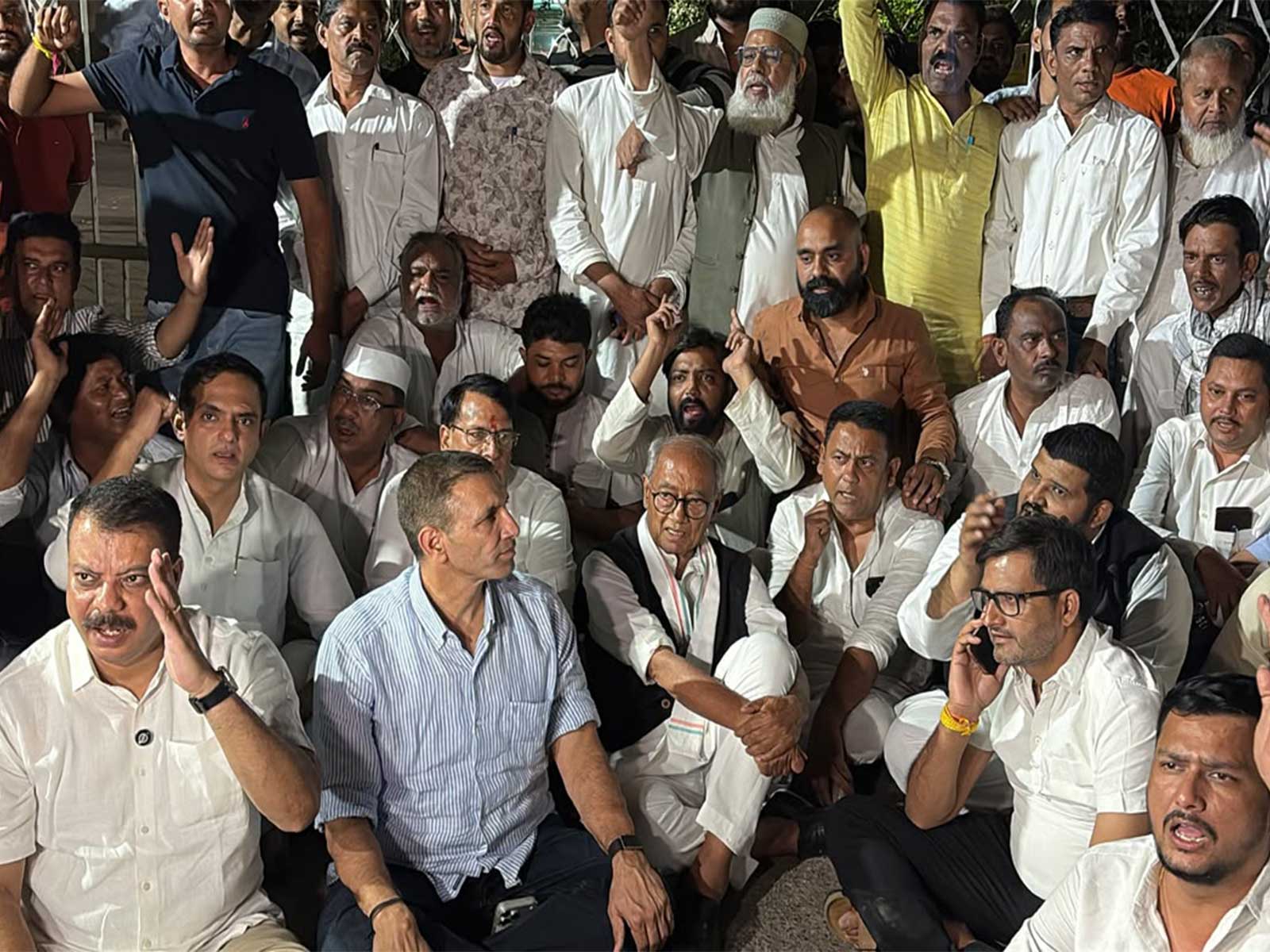 Congress leaders sit on Dharna outside election commission office in Bhopal (Photo/ANI) Congress leaders sit on Dharna outside election commission office in Bhopal (Photo/ANI)