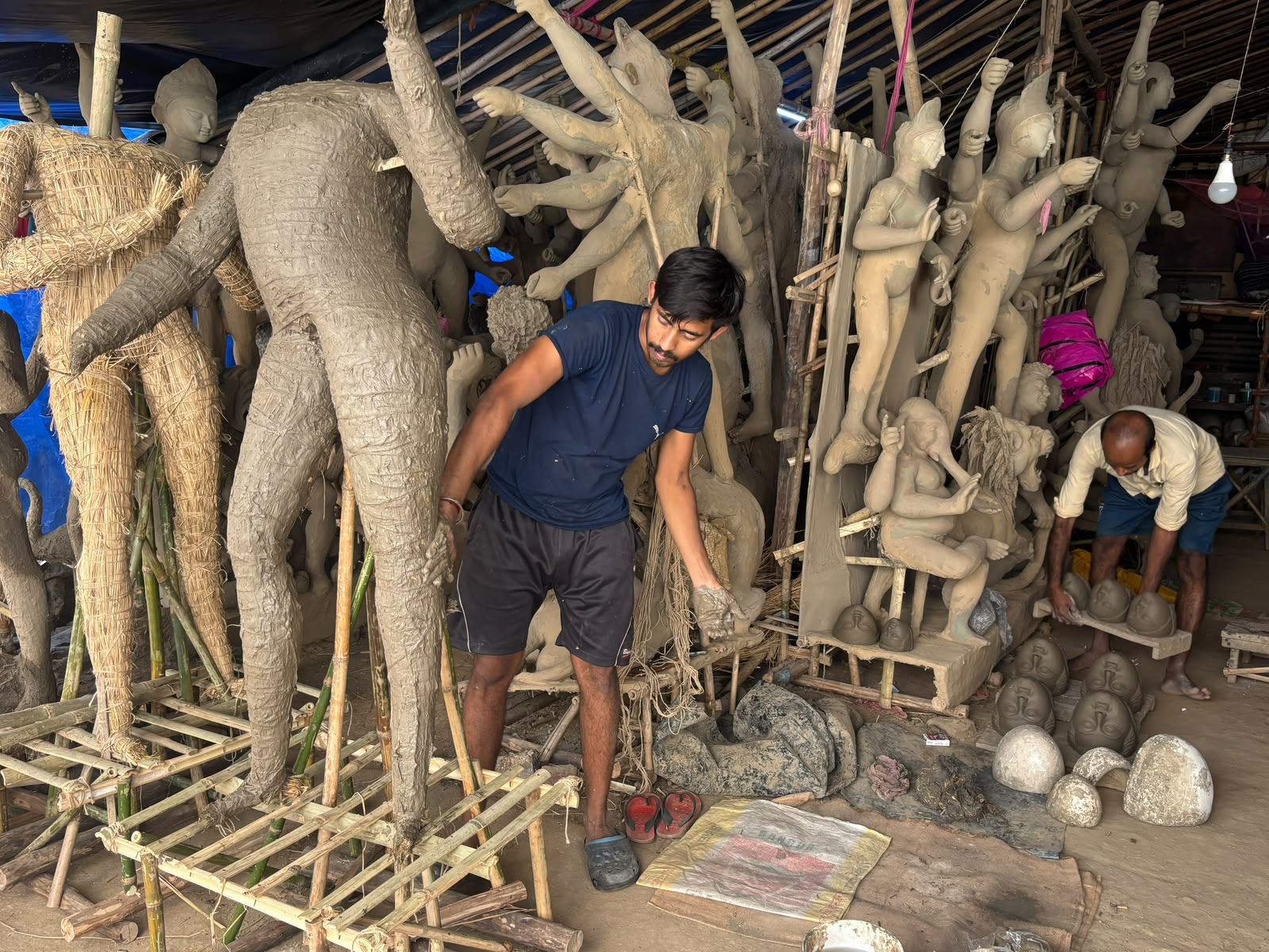 Artisan creating Durga Puja idol (Image source: ANI) Artisan creating Durga Puja idol (Image source: ANI)