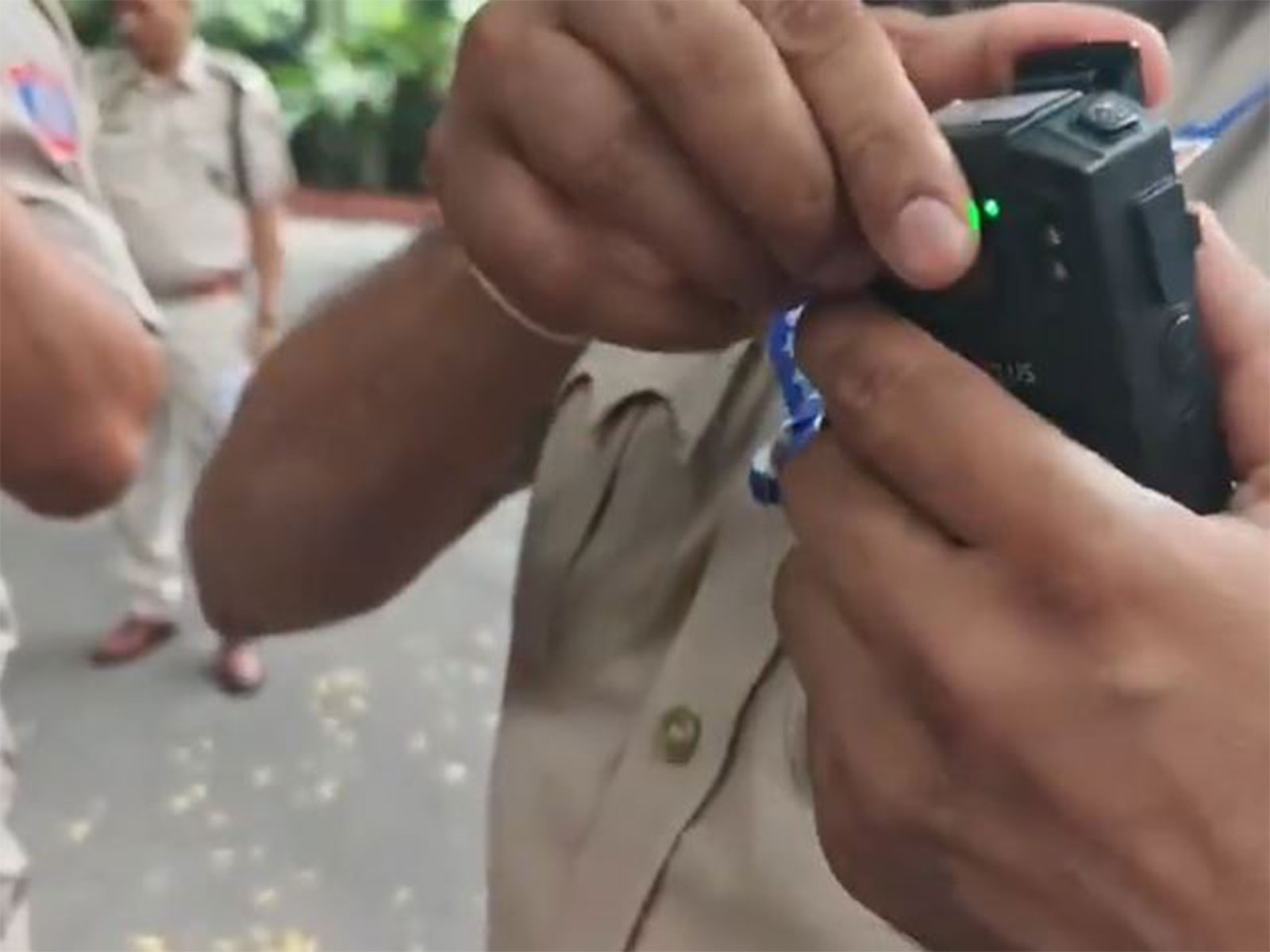 Delhi Police personnel use body cameras on their uniform (Photo/ANI) Delhi Police personnel use body cameras on their uniform (Photo/ANI)