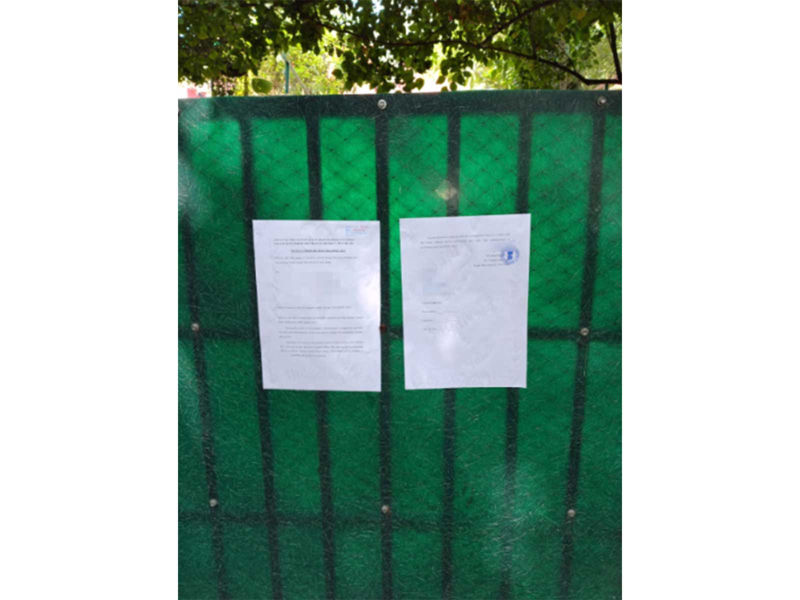 Vasant Kunj North Police Station pastes a notice outside the residence of Congress MP Angomcha Bimol Akoijam (Photo/ANI)