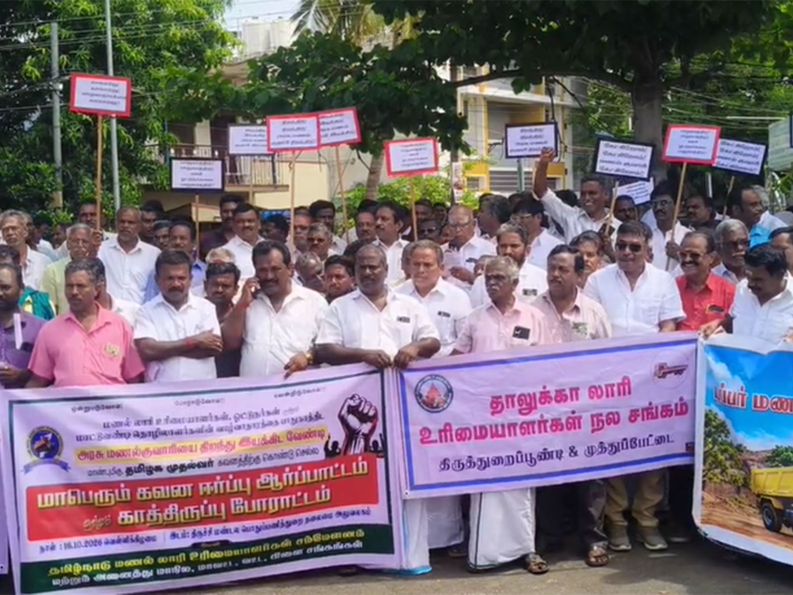 Lorry owners and drivers protest infront of PwD office in Tiruchirappalli (Photo/ANI) Lorry owners and drivers protest infront of PwD office in Tiruchirappalli (Photo/ANI)
