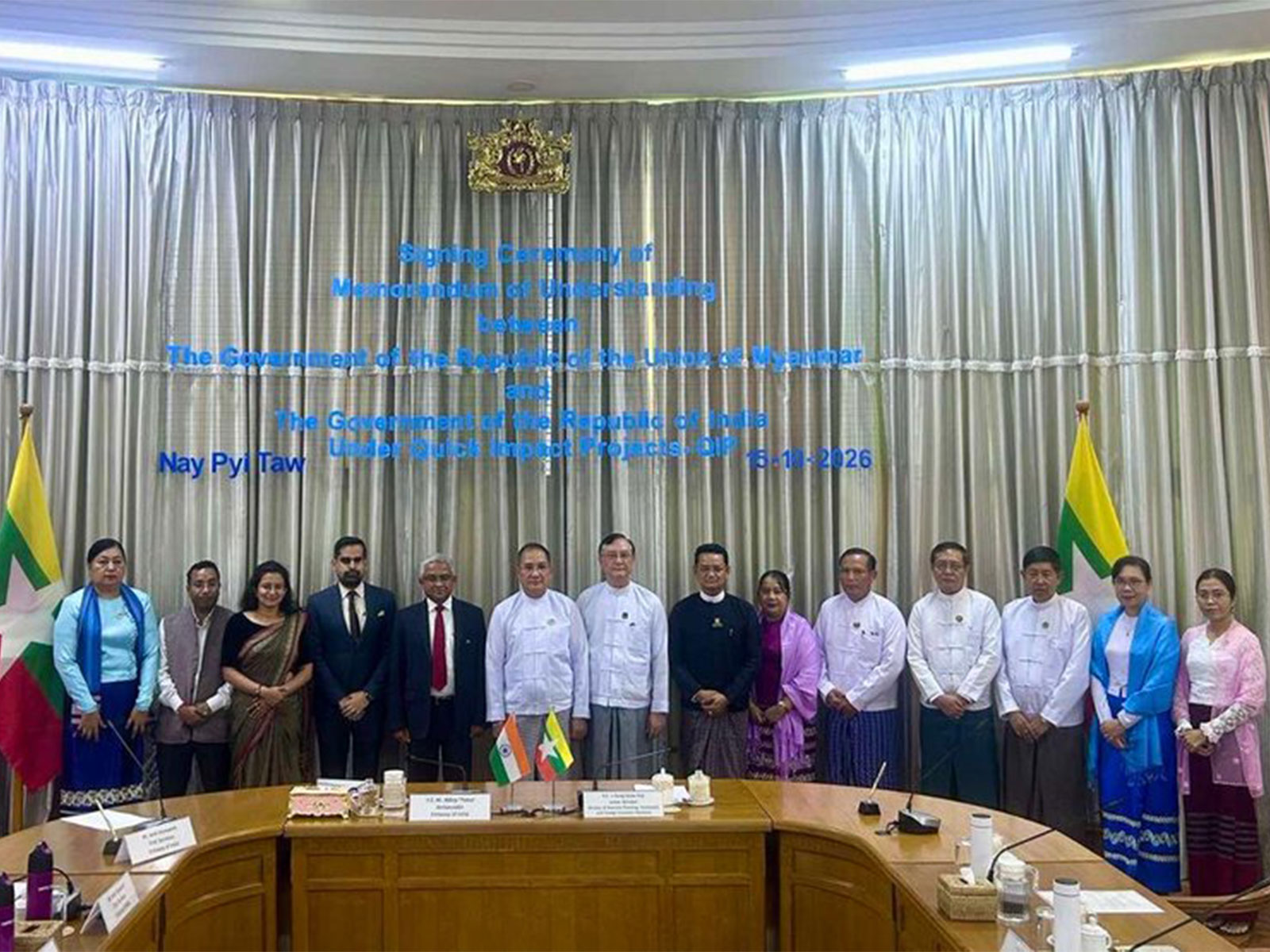 India's Ambassador to Myanmar Abhay Thakur and Myanmar's Union Minister for National Planning, Investment and Foreign Economic Relations U Aung Kyaw Hoe with officials during the signing ceremony of MoUs on five Quick Impact Projects in Naypyitaw. (Photo: X/@IndiainMyanmar) 