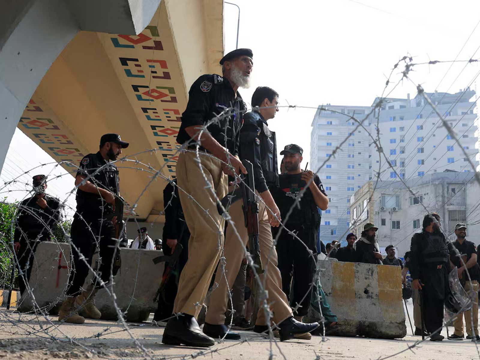 Police guard a road leading to Red Zone, in Peshawar, Khyber Pakhtunkhwa province, Pakistan. (Photo/Reuters) Police guard a road leading to Red Zone, in Peshawar, Khyber Pakhtunkhwa province, Pakistan. (Photo/Reuters)