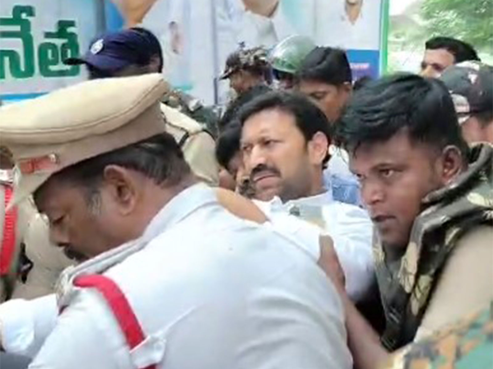 YSRCP leader being taken away by police (Photo/ANI) YSRCP leader being taken away by police (Photo/ANI)