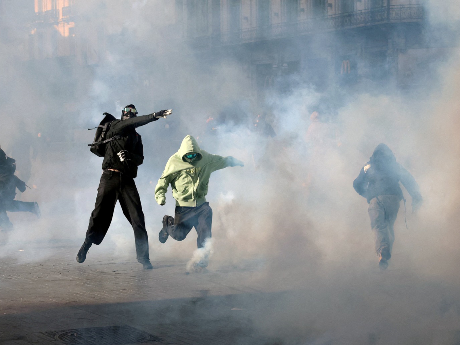 Demonstrators react to tear gas fired by police during a students' protest in Brussels, Belgium (Photo/Reuters) Demonstrators react to tear gas fired by police during a students' protest in Brussels, Belgium (Photo/Reuters)