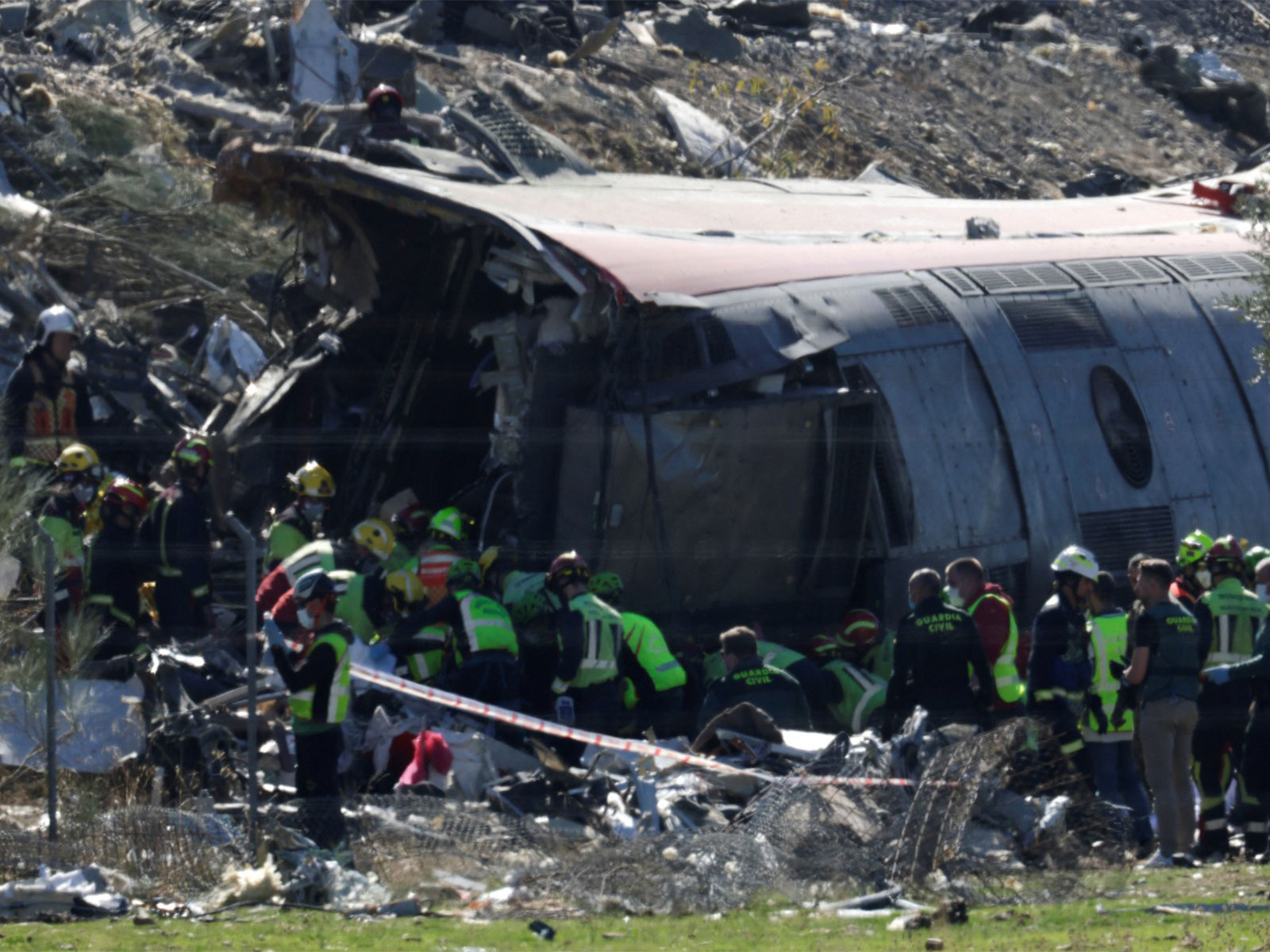 Rescue personnel work at the site following the collision of two high-speed trains in Spain (Photo/Reuters)